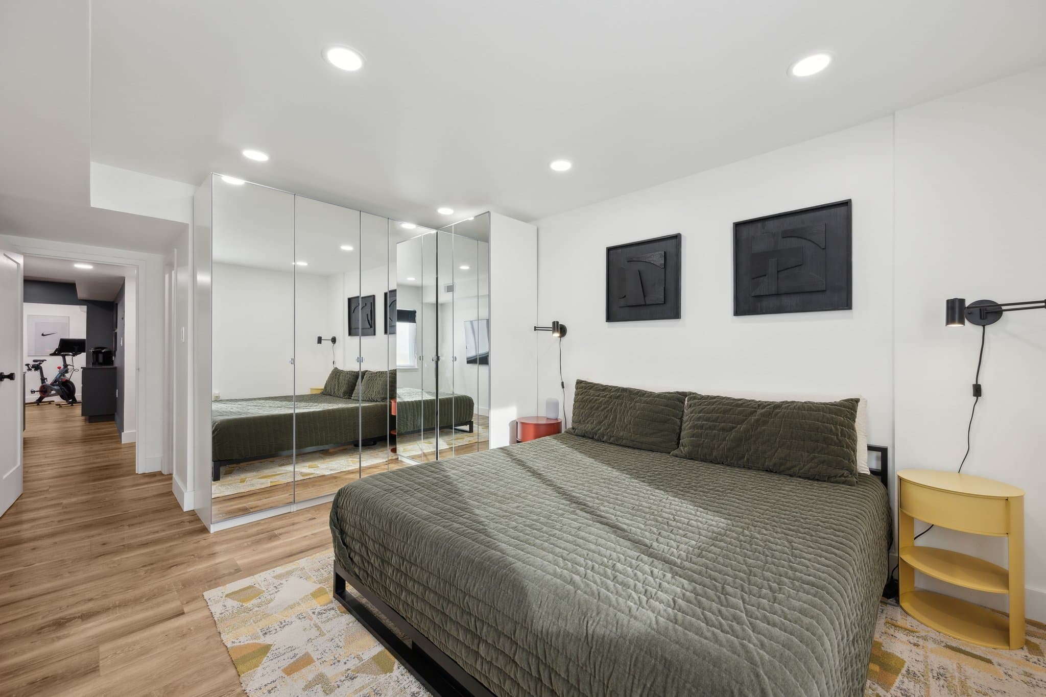 Primary bedroom with floor-to-ceiling mirrored wardrobes