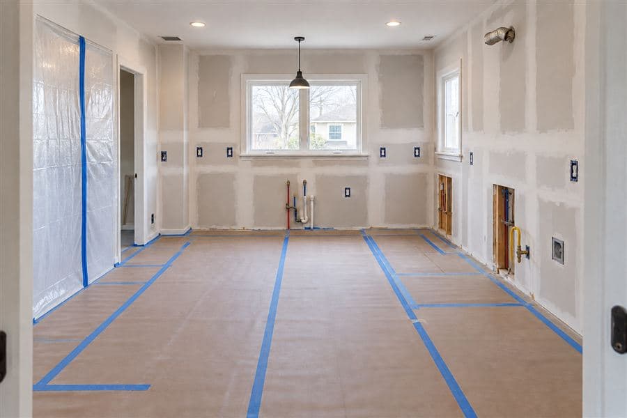 Kitchen wall repair with plumbing and electrical adjustments underway